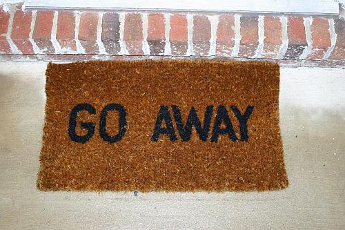 A welcome mat that says "Go Away" on it.
